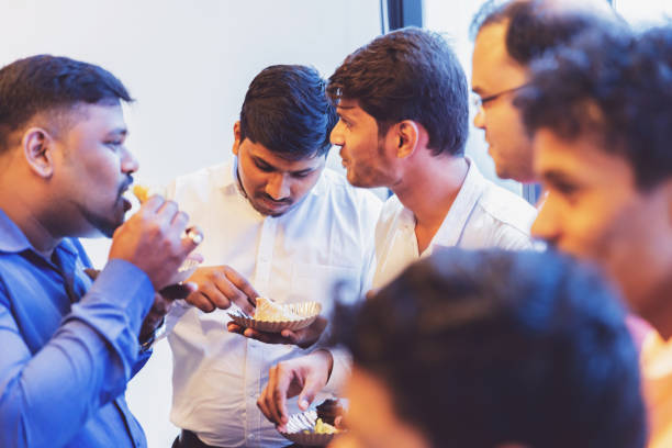 Colleagues sharing snacks and conversation